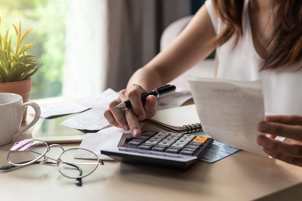 Woman using a calculator